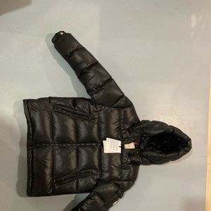 Moncler puffer comes with tag